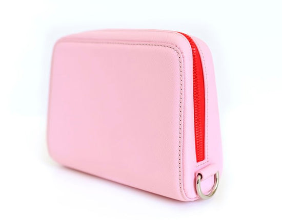pink and red fancy leather bag insualted for women on the golf course
